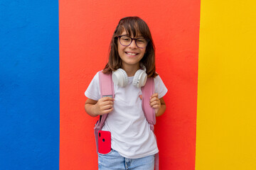 Portrait of a very smiling schoolgirl on the way back to school
