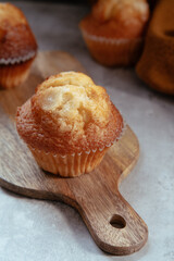 freshly baked mini muffins on a rustic table