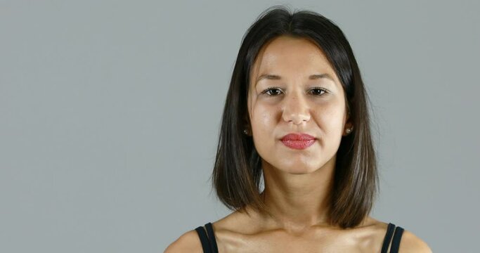 looks down but then stares you in the eyes