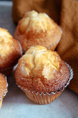 freshly baked mini muffins on a rustic table