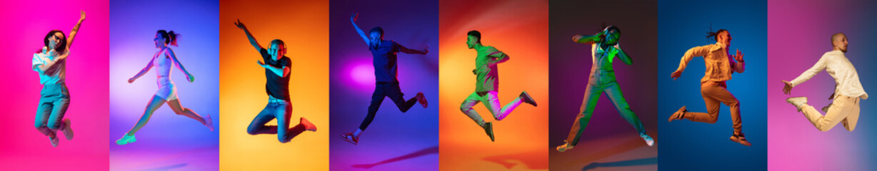 Fototapeta na wymiar Portrait of group of people jumping isolated on multicolored background in neon light, collage.