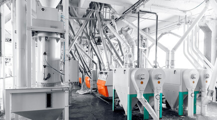 Modern electrical mill machinery for production of wheat flour. Equipment Factory Grain - obrazy, fototapety, plakaty
