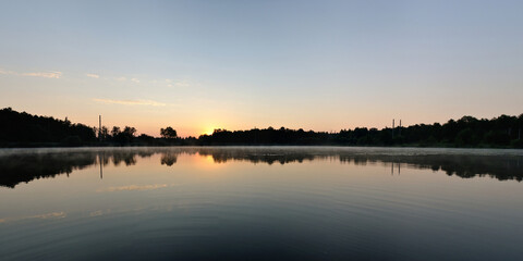 Summer fishing on the lake, dawn.