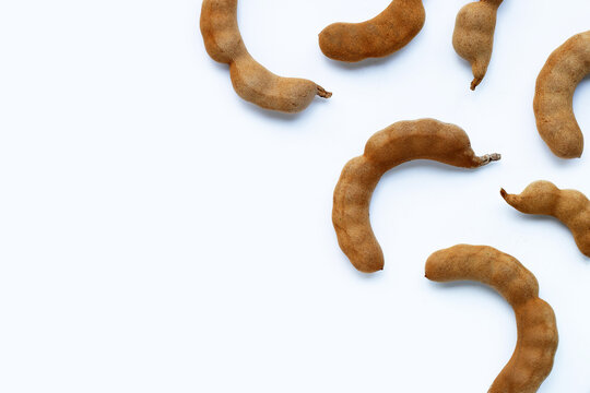 Tamarind tropical fruit on white background. Top view