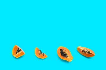 Papaya fruit on blue background.