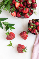 Large ripe deformed strawberries of abnormal shape. Trendy food. Concept of organic eco products....