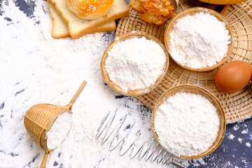 Baking background with free space for your text. flour on black table. baker with flour, Baking Cooking Ingredients Flour Eggs and Butter 