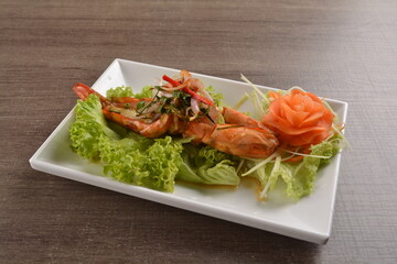 grilled bbq big tiger prawn seafood with Thai spicy chilli sauce on wood background asian halal menu