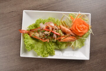 grilled bbq big tiger prawn seafood with Thai spicy chilli sauce on wood background asian halal menu