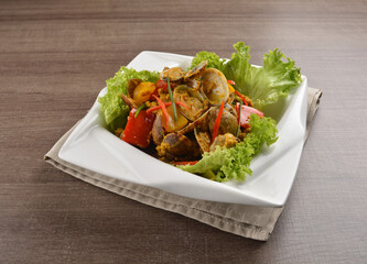 stir fried flower clam shell seafood with sambal spicy chilli sauce on wood background asian halal menu
