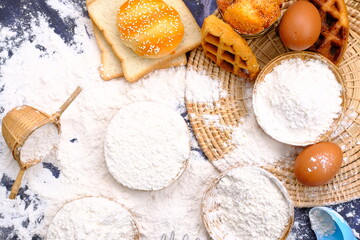 Obraz na płótnie Canvas sprinkling white flour over dough on kitchen background, Baking Cooking Ingredients Flour Eggs and Butter 