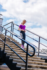 Fit woman jogging exercising running cardio workout focused female runner endurance training
