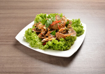 stir fried flower clam shell seafood with sambal spicy chilli sauce on wood background asian halal menu