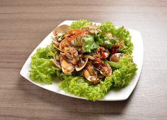 stir fried flower clam shell seafood with sambal spicy chilli sauce on wood background asian halal menu