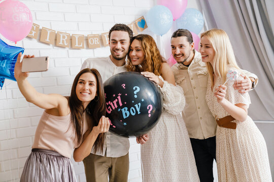 Happy young pregnant woman celebrating baby shower