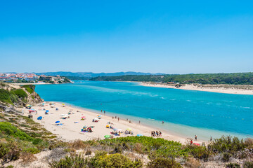 Franquia beach in Milfontes with river Mira and village in the background, Odemira PORTUGAL