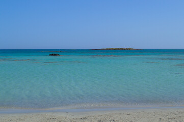 Fototapeta na wymiar Wonderful sandy beach with azure clear water.