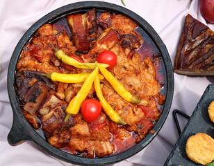 Wedding cabbage in clay pot , traditional Serbian dish consisting of sour cabbage, meat, bacon and spices