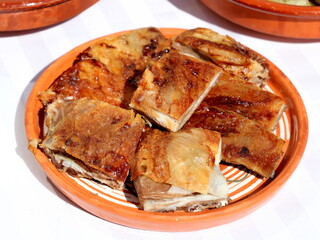 Roast pork in a plate served in a Serbian restaurant