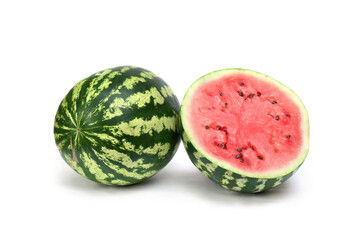 Green striped watermelon and half of watermelon on a white background