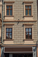 Obraz premium Rectangular sign on the building. Copy space and space for text. Mockup for design. Blank template for advertising.