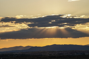 sunset over the mountains and clouds