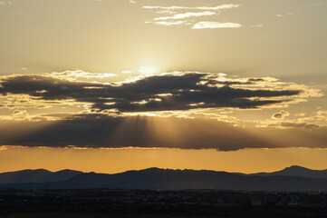 sunset over the mountains and clouds