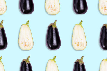 Seamless pattern of cut in half and whole ripe eggplants on a blue background