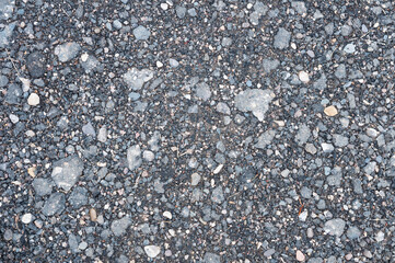 Background texture of asphalt crumbs with small stones