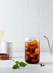 Cold black coffee with ice cubes on a white background. Coldbrew. Summer drinks.