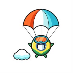 brazil flag badge mascot cartoon is skydiving with happy gesture