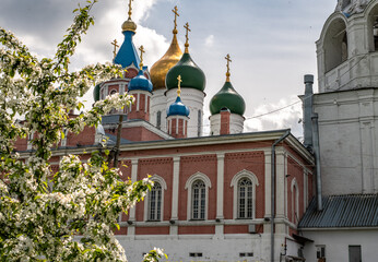 Fototapeta na wymiar Towers and dome of temples and churches with white walls in Kolomna at the Cathedral Square
