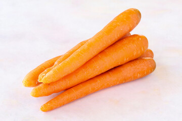Carrots on a white wooden background