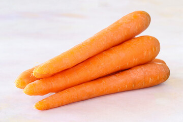 Carrots on a white wooden background