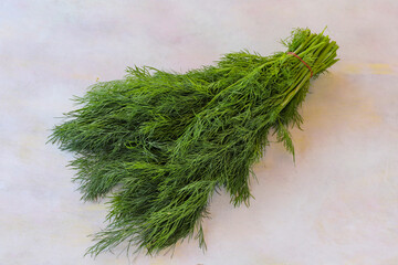 Dill on a white wooden background