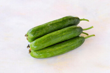 Cucumbers on a white wooden background