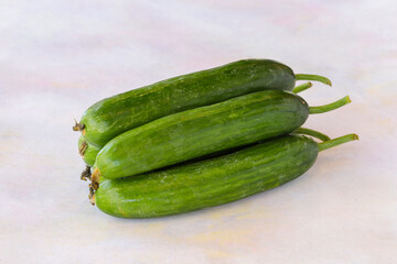 Cucumbers on a white wooden background
