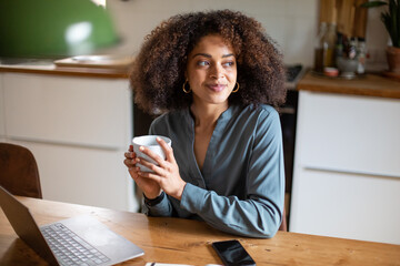 African American businesswoman working from home having coffee