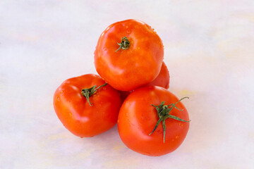 Tomatoes on a white wooden background