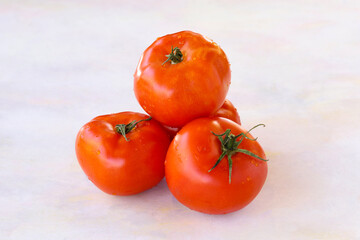 Tomatoes on a white wooden background