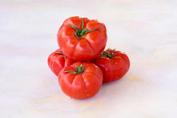 Tomatoes on a white wooden background