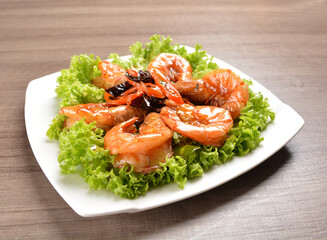 stir fried bbq tiger prawn seafood with Thai spicy chilli sweet sauce on wood background asian halal set lunch menu