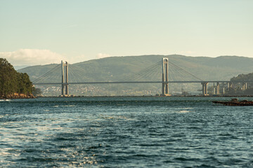 Obraz premium landscape bridge over the sea bay in day blue sky with mountain in background