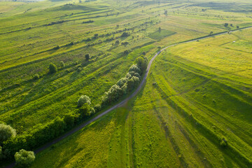 Aerial view of countryside vibrant green hills. Transylvania, Romania