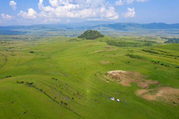 Aerial view of countryside vibrant green hills. Transylvania, Romania