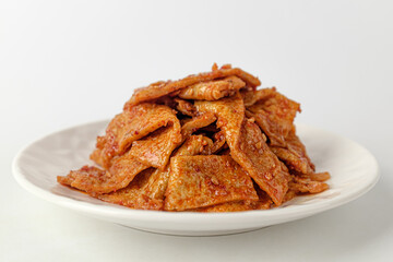 Stir-fried fish cake on white background