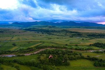 Aerial view of a storm and clouds above a village