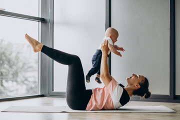 Woman with baby boy practice yoga