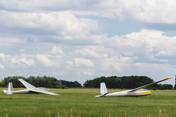 Gliders on the airfield waiting to go into the air. Aircrafts for active extreme sports of small motorless aircrafts. Soaring 