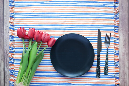 Cutlery And Empty Plate On Wooden Background Top Down